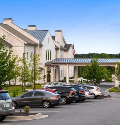 Exterior view of Claiborne at West Lake with parking area