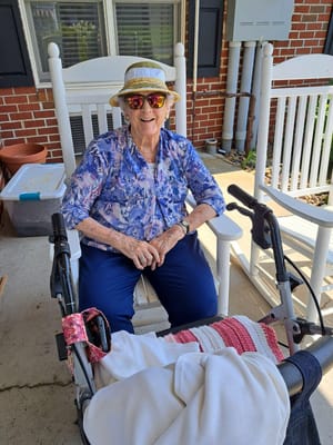 Resident enjoying a sunny day on the porch