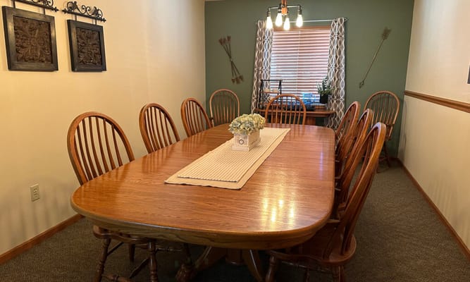 Bright dining room with wooden tables and chairs