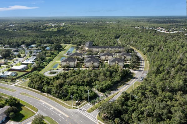 Aerial view of a senior living facility surrounded by nature