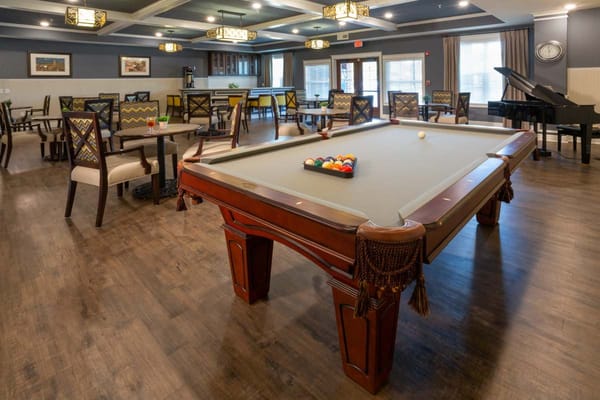 Common area with a billiards table and seating