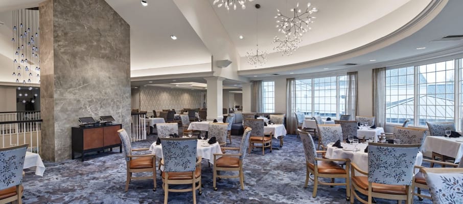 Dining area with elegant seating and decor