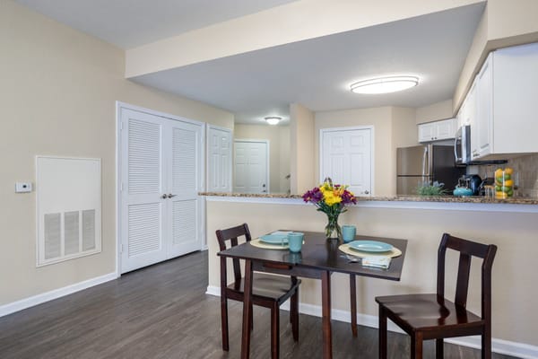 Stylish dining area in a resident unit with table and chairs