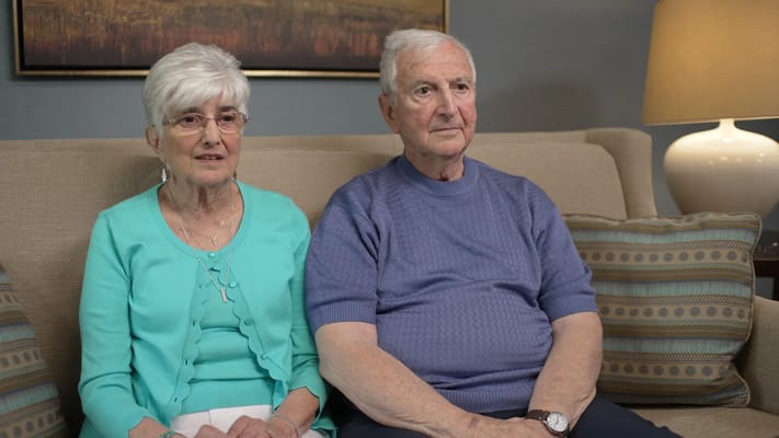 Couple sitting together in a cozy interior setting