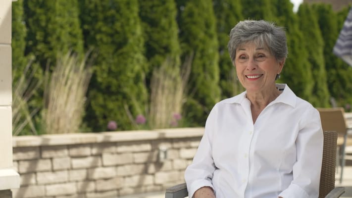 Resident enjoying the outdoors in a garden area