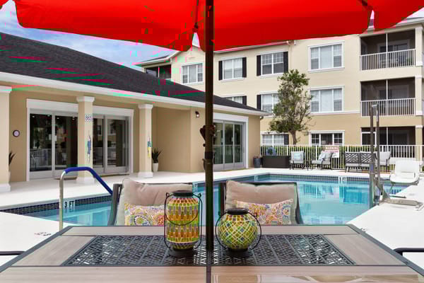 Pool area with colorful decor and furniture