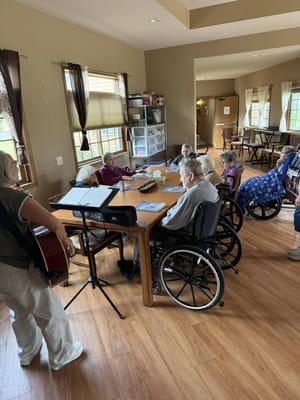 Residents enjoying a music activity in a common area