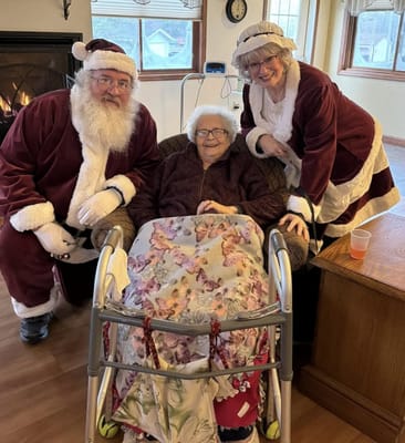 Residents with holiday characters in a cozy setting