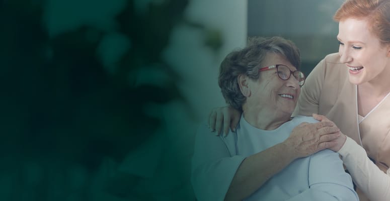 Caregiver interacting joyfully with a resident