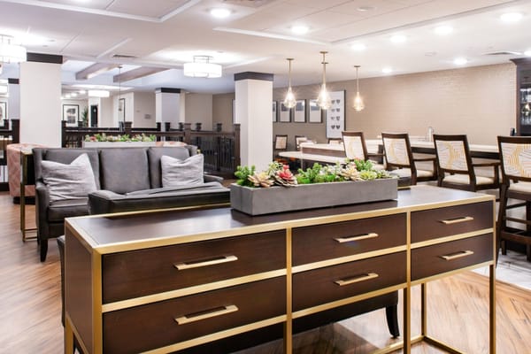 A well-decorated common area in a senior living facility