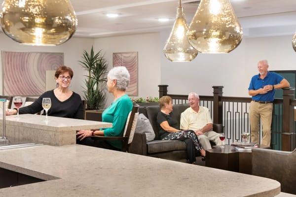 Residents socializing in a common area lounge