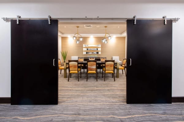 A dining area with sliding barn doors