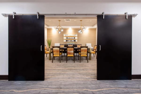 Dining room with tables and chairs visible