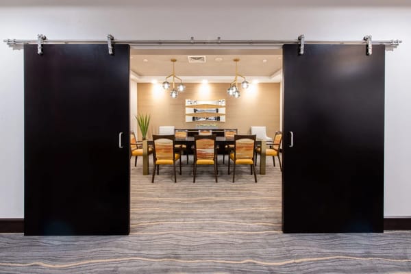 A well-lit dining room with modern decor