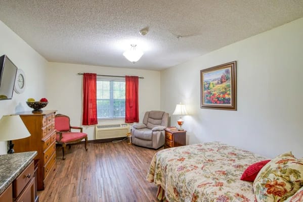 Cozy resident room with floral bedding and artwork