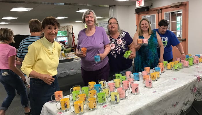 Residents enjoying an activity with colorful cups