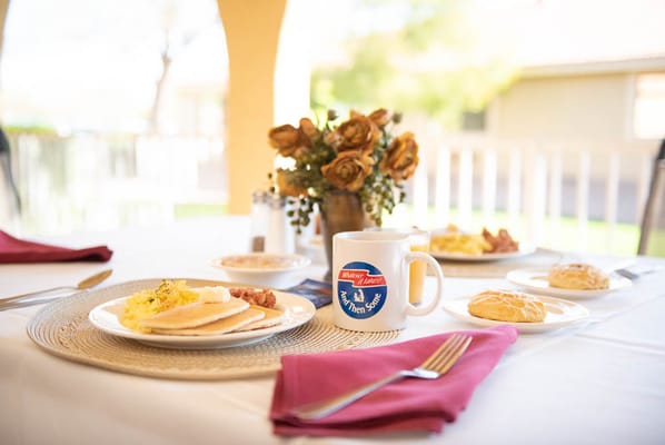 A beautifully arranged breakfast setting outdoors