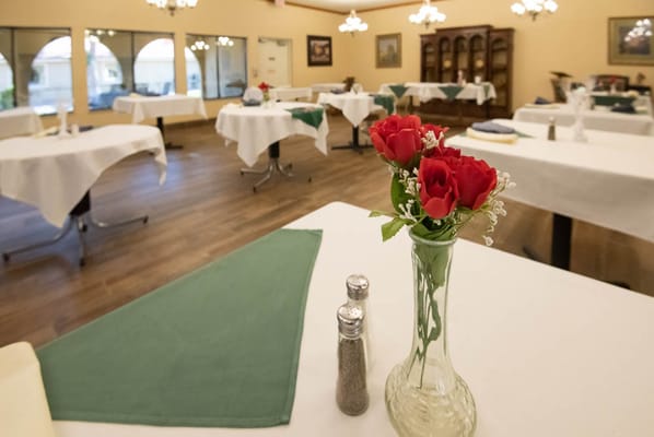 Dining area with tables set for a meal