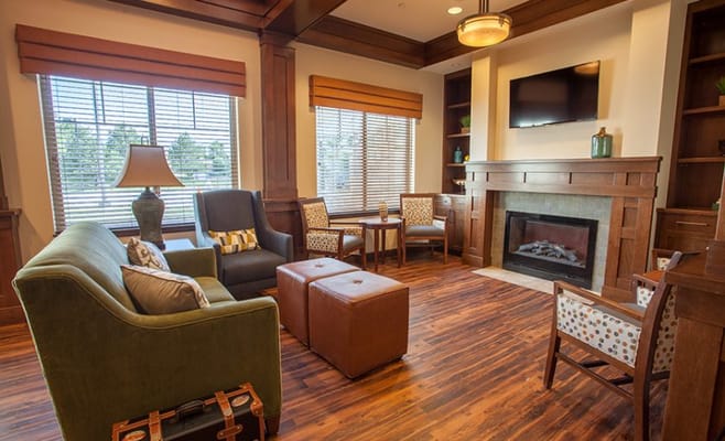 Cozy interior common area with seating and fireplace