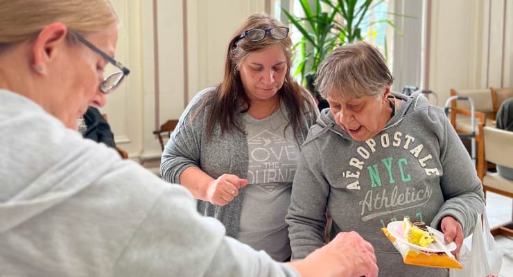 Residents and staff engaged in an activity together