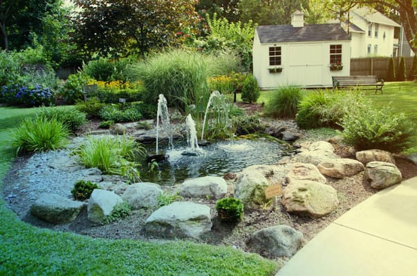 Beautiful landscaped garden with a pond and fountain