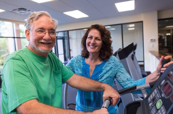 Residents using equipment in the fitness center