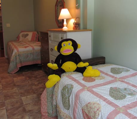 Cozy resident room with colorful bedding and stuffed animal