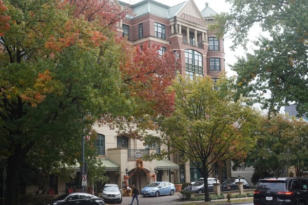 Entrance view of Sunrise of Connecticut Ave surrounded by colorful autumn trees
