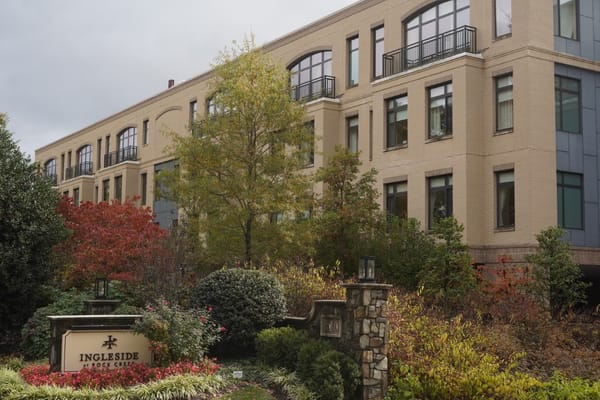 Exterior view of Ingleside at Rock Creek with autumn foliage