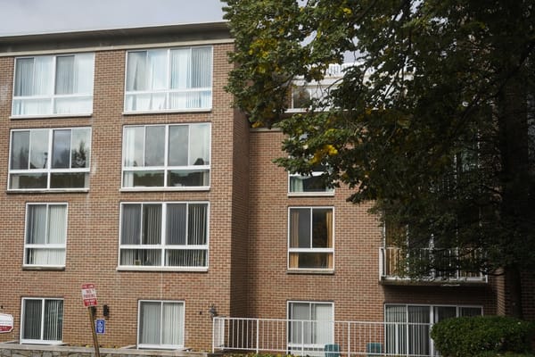 Exterior view of a residential building with large windows