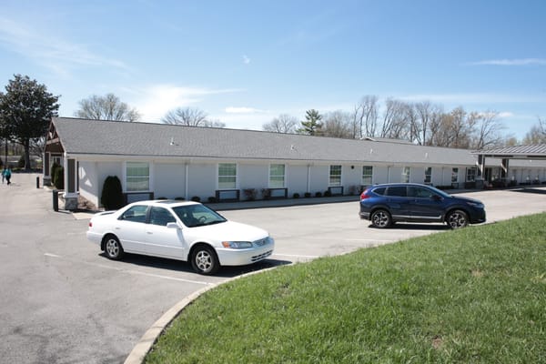 Exterior view of the facility with parked cars