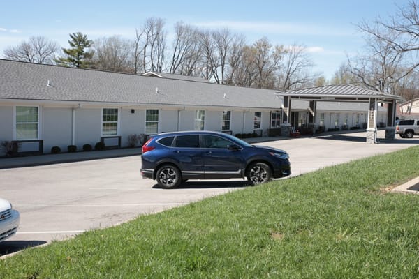 Outdoor view of the facility parking area and building entrance