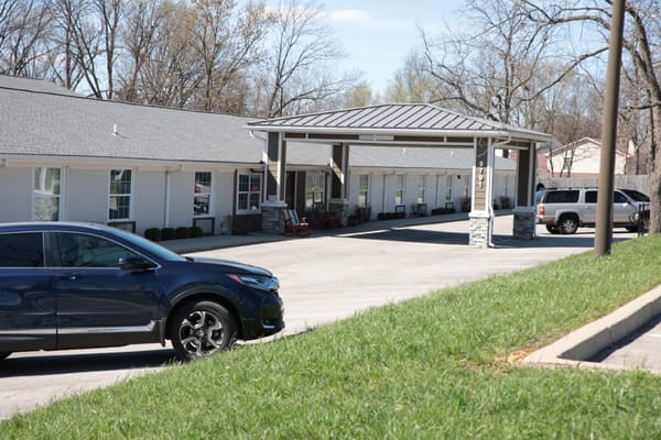 View of the facility's front entrance and parking area