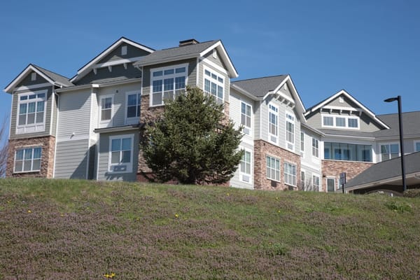 Exterior view of a senior living facility on a sunny day