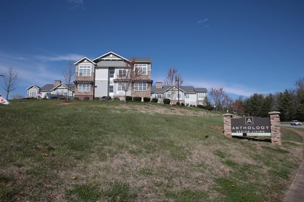 Exterior view of an assisted living facility with landscaping