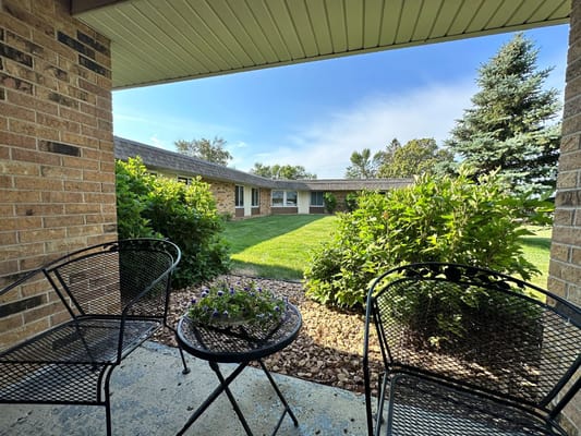 View of outdoor garden area with seating