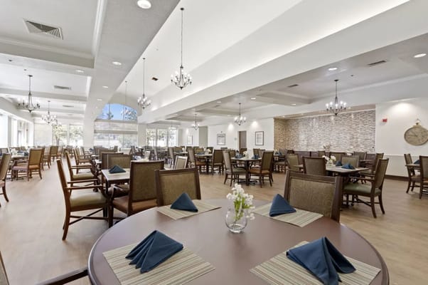 Elegant dining area with tables set for dining