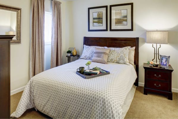 Cozy private bedroom with a neatly made bed