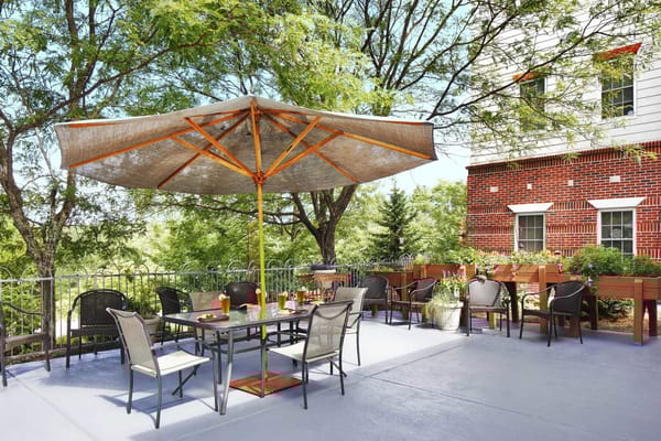 Outdoor patio with seating and umbrellas