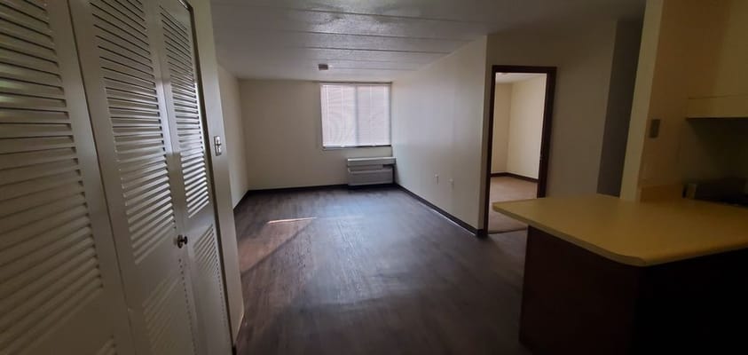 Bright interior of a resident room with light flooring