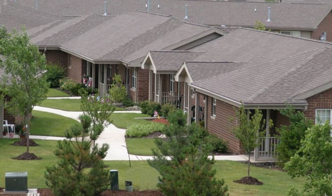 View of single-story cottages in landscaped area