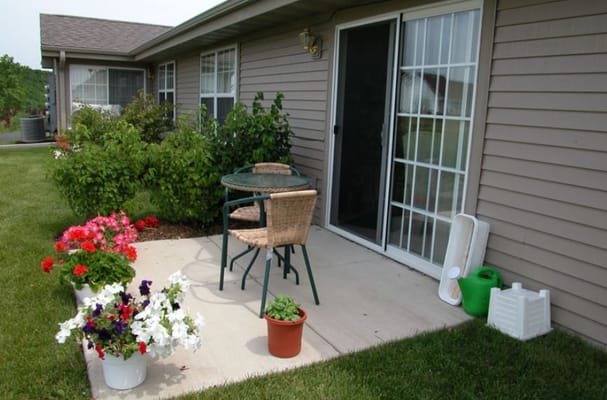Patio area with flowers and seating