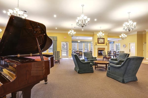 Common area with piano and comfortable seating