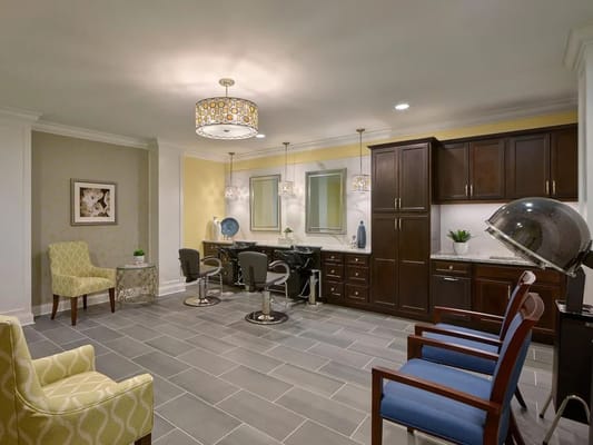 Hair salon area with styling chairs and decor