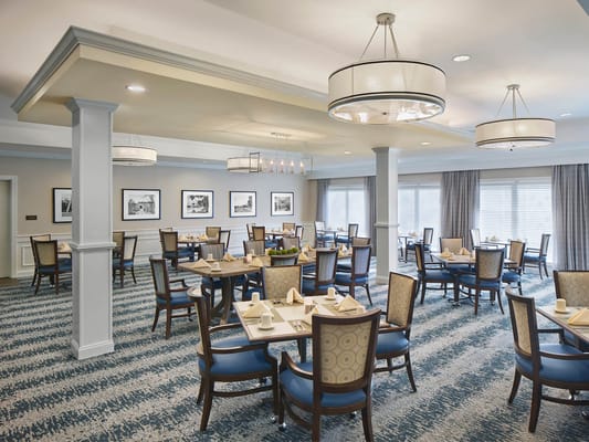 Bright dining area with tables set for meals