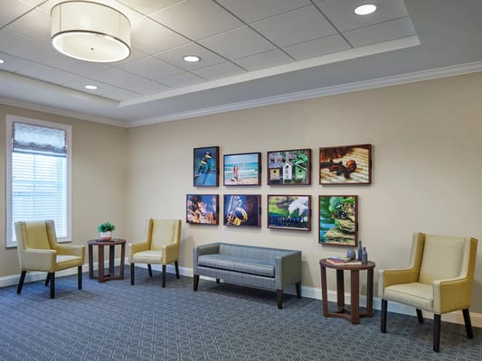 Lounge area with seating and artwork on walls