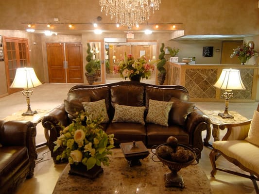 Cozy common area with sofas and chandeliers