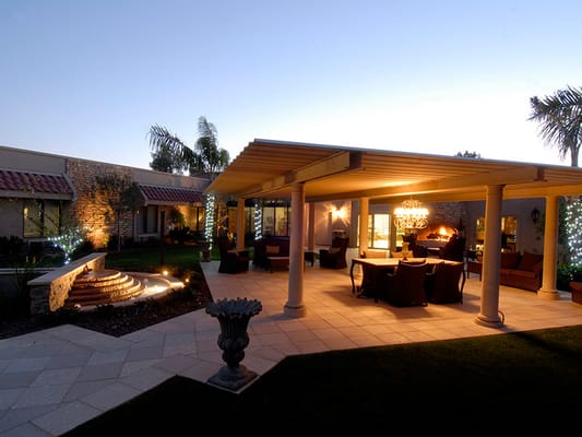 Outdoor patio area with seating and lighting
