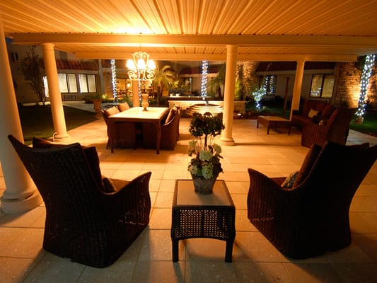 Cozy outdoor seating area with lighting and plants