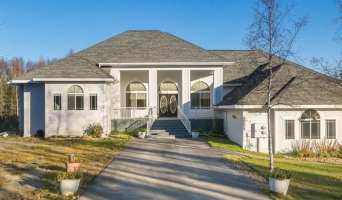 Exterior view of a senior living facility with broad steps